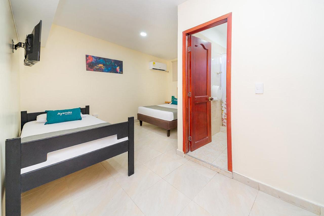 Ayenda Baly Express Hotel Malambo Exterior photo