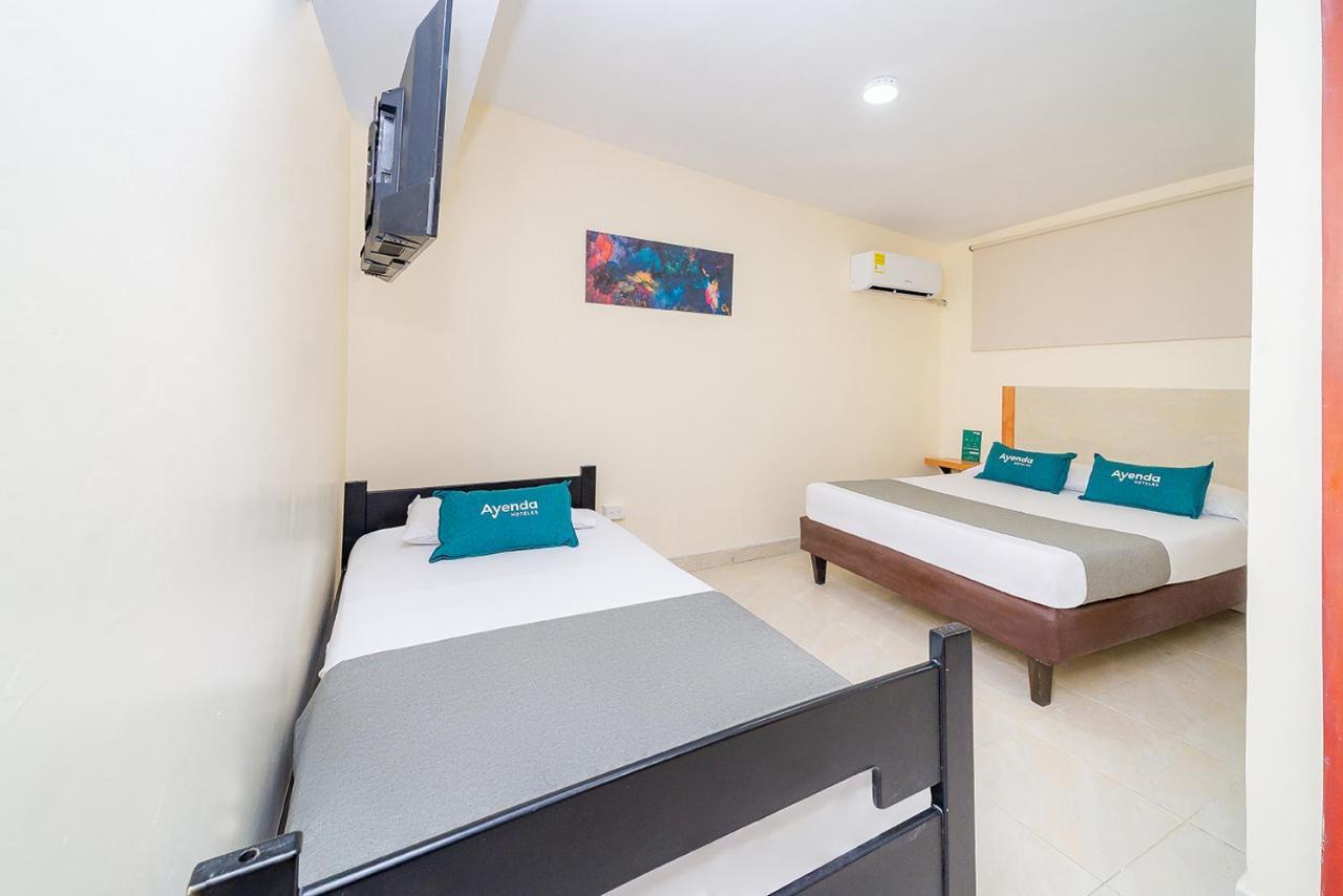 Ayenda Baly Express Hotel Malambo Exterior photo